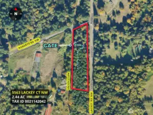 Overhead view with approximate boundaries in red along with gate and driveway.