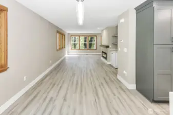 Main floor living area with electric fireplace.