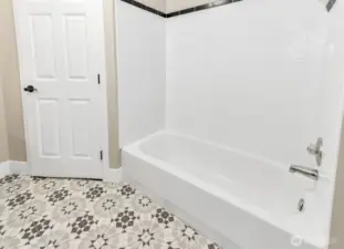 Upstairs full bathroom tub and shower.