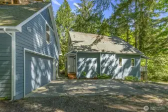 Side view of home. You can see the garage and side entrance into home.