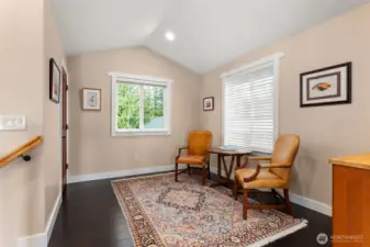 North Tower landing w/ seating, walk-in closet to the left. Wet bar or coffee station on the right.