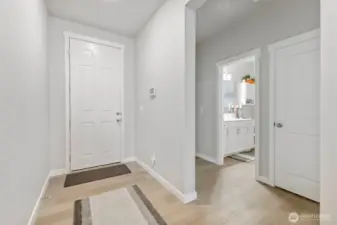 Back toward the entryway are the 2nd & 3rd bedrooms and a full bath.