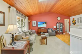 Living room with vaulted pine ceilings