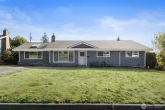 Spacious rambler with 3 bdrms, 1.75 baths, 2 large living areas and generous yard in front and back.