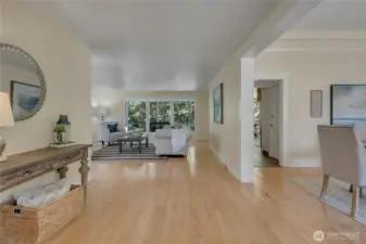 From entry:  main level living room, dining to right and kitchen through hallway.  Main level bed and bath to the right, past dining room.  Slider to covered porch through kitchen.  Hardwood floors.  Fresh paint throughout.
