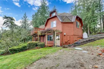 Three story home. Tan door leads to downstairs space that could be used as primary suite.