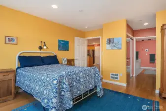 Primary bedroom and entry to the primary bathroom