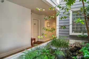 Open air vestibule leading to the condo