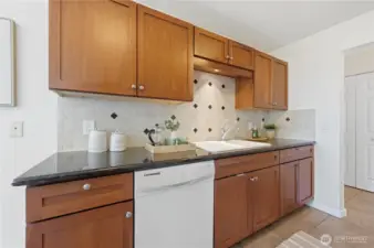 Here's another look at the other side of the kitchen, plenty of cabinet storage space.
