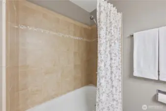 Gorgeous tile soaking tub in guest bath.