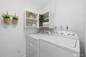 Rare laundry room with full size, side by side washer & dryer & plenty of additional space for storage.