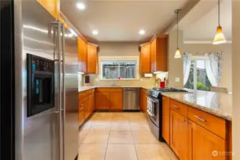 Spacious kitchen with all stainless steel appliances.
