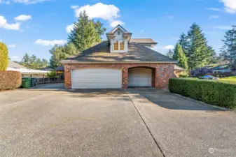 Expansive driveway and three-car garage