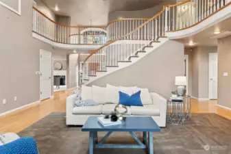 The staircase is a stunning centerpiece of the home