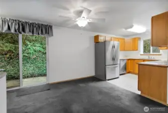 Rear patio and deck off kitchen slider.
