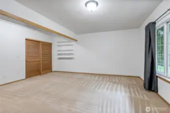 Downstairs primary with full bath or extra family room.