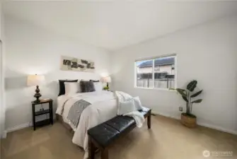Tucked at the end of the hall if a spacious primary bedroom!