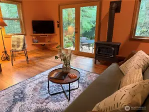 Living room with large doors to private deck