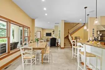 Between the kitchen eating bar and the patio windows there is an additional eating area,