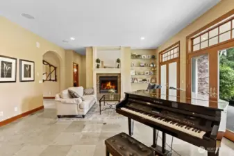 The living room with its fireplace and French patio doors.