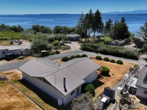 Metal roof and plenty of yard space. Enjoy stunning sunsets and ship action through Admiralty's Inlet.