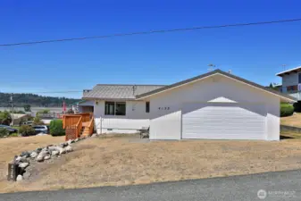 This is the Southern side of your beach home. Two Car Garage. You can access the house through the garage or via the sliding glass doors on the front deck. There is a back entrance on the north side of the house as well.