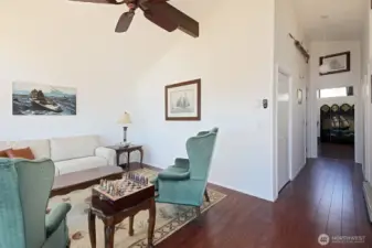 Let's go check out the bedroom, full bath & Family Room/potential Primary Suite. In the hallway are two closets. The bedroom is the last door on the left (in hallway), Family Room is straight ahead, bath is across the hallway from the bedroom (right side of hallway).