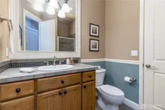 Main floor bathroom with a shower includes direct access from the office