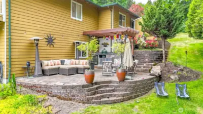 This luxurious outdoor oasis is an entertainer's dream, seamlessly blending high-end amenities with natural beauty.