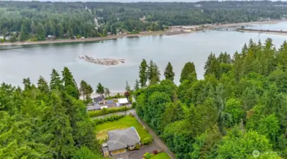 Stunning view and the property is nestled amidst lush evergreen trees, offering a tranquil and private setting.