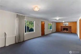 Wood burning fireplace and outdoor access.