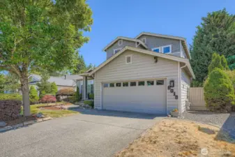 Front of home with 2 car garage and driveway for guests