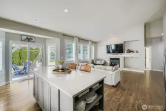 Enjoy the natural light beaming through your open concept kitchen with beautiful hard wood floors