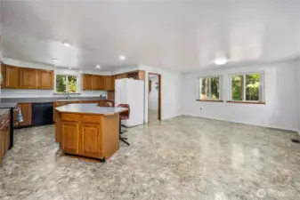 Kitchen eating area, plenty of space for large gatherings...flooded with natural light and ventilation with 4- 48" wide doble slider windows.
