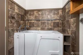 Primary bath, walk in tub with tile surround