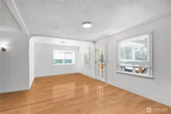 Den/office, personal items have been digitally removed.