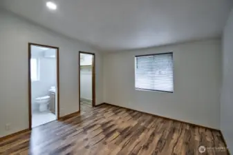 Primary Suite with full bath and walk-in closet.
