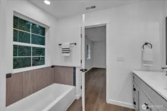 Cozy soaking tub in primary.