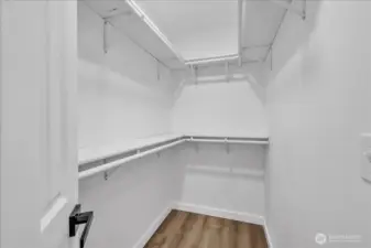 Extra large walk-in closet in primary.
