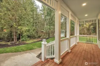 view exiting the front door of the home under the covered porch.