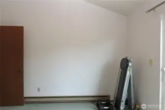 VIEW OF THE PRIMARY BEDROOM TO THE DOWNSTAIRS DOORWAY!