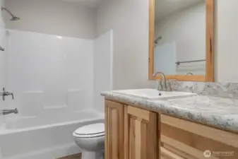 The first of two identical bathrooms