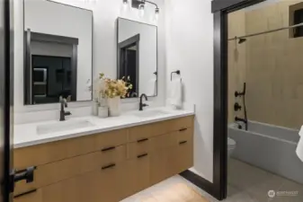 5th bedroom bathroom w/dual vanity and tub/shower combo.