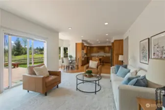 Family room with sliding door to oversized deck. View looking back to the kitchen.