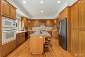 Two oversized chopping boards, two corner cabinets with lazy susans, pull out drawers on lower cabinets, two appliance garages, two glass cabinets with display lighting...finally there is a space for every gadget and appliance.