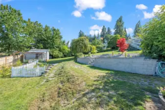 The backyard has a vegetable garden, chicken coop & storage shed.  There's so much to see & do on this rural property that is a short stroll away from all the fun in downtown Gig Harbor.