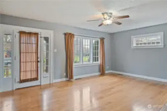 Living room with bamboo flooring and wood burning fireplace