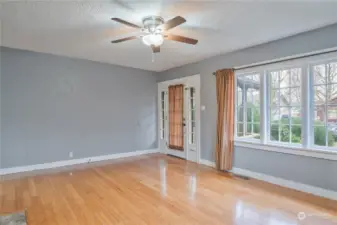 Living room with bamboo flooring and wood burning fireplace