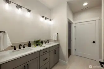 Primary on-suite - *Former Sinclair floor plan. Garage left. Finishes may vary.