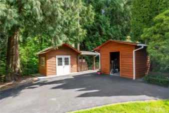 Building with pizza oven on the left, utility shed on the right.